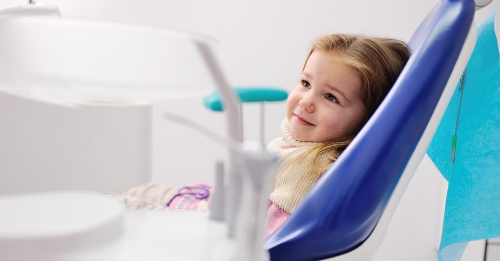 kid grins first dental visit header