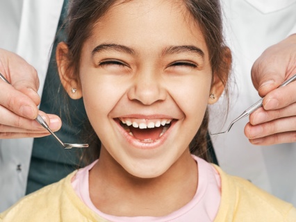 early-orthodontic-1 Child receiving early orthodontic evaluation at Kid Grins Pediatric Dentistry